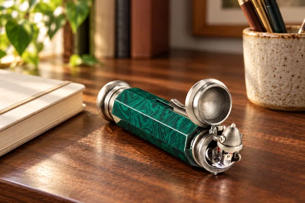 AI styling illustration of a green marbled Deluminator replica with its silver lid open on a desk