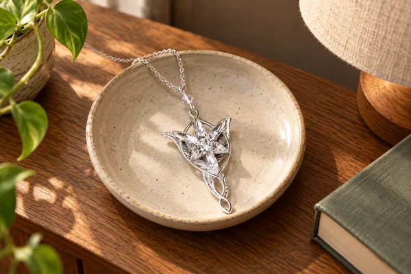 AI styling illustration of Arwen’s Evenstar pendant in a bedside jewellery dish